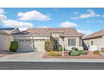 Charming single-story home with well-manicured landscaping and a two-car garage at 1802 Cypress Mesa Dr, Henderson, NV 89012