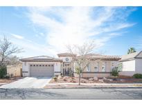 Charming single-story home with desert landscaping and a spacious three-car garage at 1901 Shady Elm St, Las Vegas, NV 89135