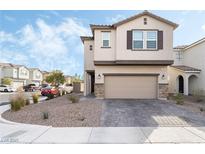 Two-story house with attached garage and landscaped front yard at 7281 Saxby Ave, Las Vegas, NV 89113