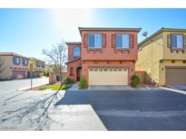 Two-story townhome with attached garage and landscaping at 8557 Nature Scene Dr, Las Vegas, NV 89139