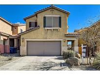 Two-story home featuring a two-car garage, desert landscaping, and a For Sale sign at 8956 Rutherford Grove St, Las Vegas, NV 89148