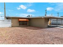 Ranch style home with carport and gravel landscaping at 4554 S Nellis Blvd, Las Vegas, NV 89121