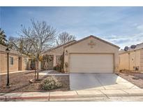 One-story house with attached garage and landscaped front yard at 5529 Eagle Claw Ave, Las Vegas, NV 89130