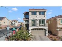 Beautiful two-story home with balcony over garage and desert landscaping at 5988 Pirates Delight Ave, Las Vegas, NV 89139