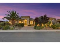 Charming single-story home featuring lush landscaping and a welcoming walkway leading to the front door at 6425 Orto Botanico Ct, Las Vegas, NV 89131