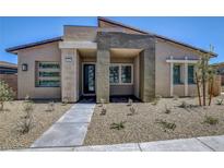 Modern single-story home with desert landscaping and neutral color palette at 913 Allister Fields Ln, Las Vegas, NV 89138
