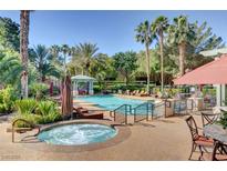 Relaxing resort-style pool and spa with comfortable lounge chairs at 1700 Hills Of Red Dr # 202, Las Vegas, NV 89128