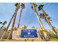 Colorado Bay Club entrance with palm trees and signage at 2173 Aspen Mirror Way # 101, Laughlin, NV 89029