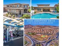 Two-story home with stone accents and a tile roof at 2920 Josephine Dr, Henderson, NV 89044