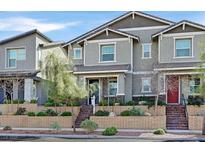 Charming two-story home with landscaped yard and brick accents creating curb appeal at 726 N Water St, Henderson, NV 89015