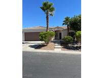 Single-story house with a two-car garage and landscaped front yard at 8134 Dancing Ave, Las Vegas, NV 89131