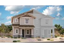 Two-story home with gray siding, stone accents, and a front porch at 858 Cottonwood Hill Pl, Henderson, NV 89011