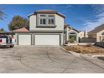 Two-story house with a two-car garage and landscaped yard at 1506 Champagne Cir, Las Vegas, NV 89119