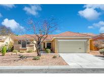 Inviting single-story home with a well-maintained yard and two-car garage, perfect for comfortable living at 2056 Oliver Springs St, Henderson, NV 89052
