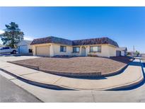 Single story home with attached garage and landscaped yard at 291 Duke Of Wales Ct, Henderson, NV 89015