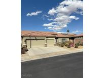 Charming single-story home featuring a red tile roof, desert landscaping, and a spacious three-car garage at 1008 New Creek Ave, Henderson, NV 89015