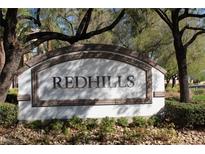 Redhills community entrance sign at 1608 Hills Of Red Dr # 204, Las Vegas, NV 89128