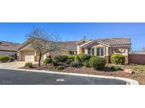 Single-story house with landscaped yard and two-car garage at 6412 Moss Agate Dr, Las Vegas, NV 89131