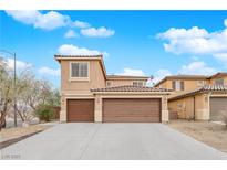 Two-story house with brown garage doors and neutral exterior at 8356 San Mateo St, North Las Vegas, NV 89085
