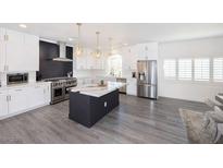 Modern kitchen with stainless steel appliances and marble island at 10658 Salmon Leap St, Las Vegas, NV 89183