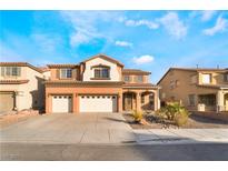 Two-story house with three-car garage and desert landscaping at 126 Cricklewood Ave, Henderson, NV 89002