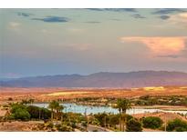 Stunning aerial view of lakefront community with mountain backdrop at 176 Kimberlite Dr, Henderson, NV 89011