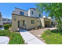 Two-story townhome with modern facade and landscaped walkway at 3634 Tripoli Cove Ave, Las Vegas, NV 89106