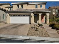 Two-story home featuring a spacious two-car garage and a meticulously landscaped front yard at 9022 Sosa Creek Ave, Las Vegas, NV 89149