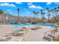 Resort-style pool area surrounded by lush landscaping and comfortable lounge seating at , Las Vegas, NV 89117