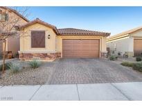 Charming single-story home with a two-car garage and desert landscaping at 1209 Crystal Grotto Ave, North Las Vegas, NV 89081