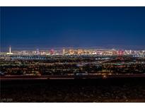 Expansive night view of the Las Vegas cityscape, showcasing vibrant lights and the iconic skyline at 2384 Ridgeline Wash St, Las Vegas, NV 89138