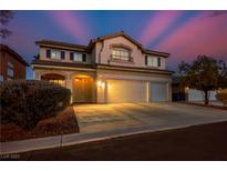 Charming two-story home featuring a well-manicured front yard and a spacious three-car garage at 3146 Surf Spray St, Las Vegas, NV 89117