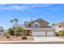 Charming two-story home featuring a three-car garage, well-maintained landscaping, and a welcoming facade at 3305 Cutty Sark St, Las Vegas, NV 89117