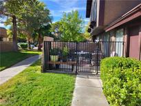 Private patio with wrought iron furniture and lush landscaping at 4537 Buena Vista Dr, Las Vegas, NV 89102