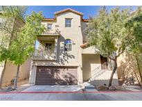 Two-story townhome with attached garage and landscaping at 4793 Cannon Hill Ct, Las Vegas, NV 89130