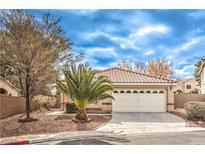 Charming single-story home with a well-manicured lawn and a two-car garage at 2153 Hookcross Cir, Henderson, NV 89074