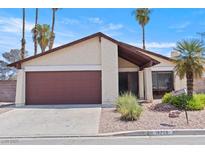 Charming single-story home featuring desert landscaping and a two-car garage at 4716 Mountain Valley Rd, Las Vegas, NV 89121