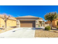 Charming single-story home with a two-car garage, desert landscaping, and a tile roof at , Las Vegas, NV 89122