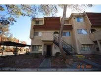 Two-story condo building with red tile roof and exterior stairs at 3561 Arville St # 801B, Las Vegas, NV 89103