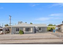 Gray single-story house with a carport and small front yard at 465 Federal St, Henderson, NV 89015