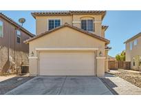 Charming tan two-story home featuring a spacious two-car garage and tile roofing at 5329 Fireside Ranch Ave, Las Vegas, NV 89131