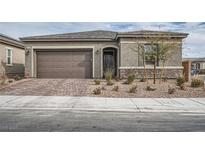 Charming single-story home with a well-maintained front yard and a two-car garage at 6016 La Coste St, North Las Vegas, NV 89081