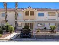 Inviting condo featuring covered parking, desert landscaping, and a neutral color palette at 700 Aztec Cir # 2E, Mesquite, NV 89027