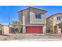 Modern two-story home showcasing a red garage door and low-maintenance landscaping at 795 Ruby Sedona Ave # Lot 128, North Las Vegas, NV 89081