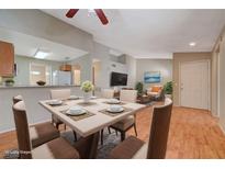 Bright dining area with table and chairs, open to living room at 1800 Edmond St # 252, Las Vegas, NV 89146