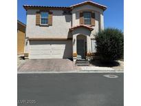 Two-story house with attached garage and landscaping at 2130 Trebbiano Way, Las Vegas, NV 89156