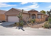 Inviting single-story home showcasing desert landscaping and a neutral color palette at 6151 Moonlight Sonata Ave, Las Vegas, NV 89122