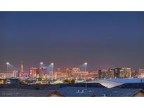 Panoramic city view showcasing the Las Vegas skyline at dusk from a residential neighborhood at 8560 Foundry Branch Ln, Las Vegas, NV 89113