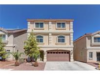 Three-story home featuring a two-car garage, desert landscaping, and a red tile roof at 6074 Gordon Creek Ave, Las Vegas, NV 89139