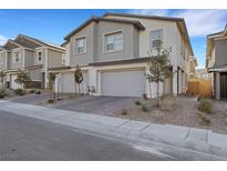 Beautiful new construction home featuring a spacious two-car garage and modern architectural details at 787 Cottonwood Hill Pl, Henderson, NV 89011